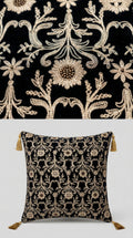 Decorative pillow with intricate floral pattern on a black background