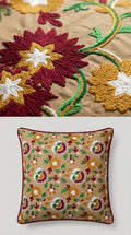 Embroidered pillow with floral patterns on a beige background