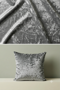 Gray textured fabric and a matching pillow on a neutral background
