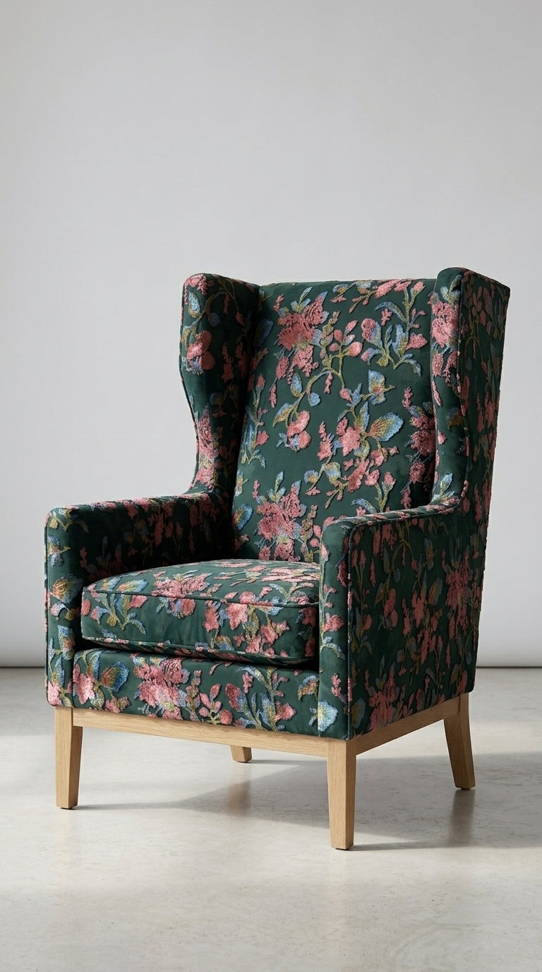Floral-patterned wingback chair on a light gray background