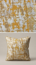 Abstract distressed jacquard fabric in gold and ivory — close-up of woven texture, Karigari Fabrics